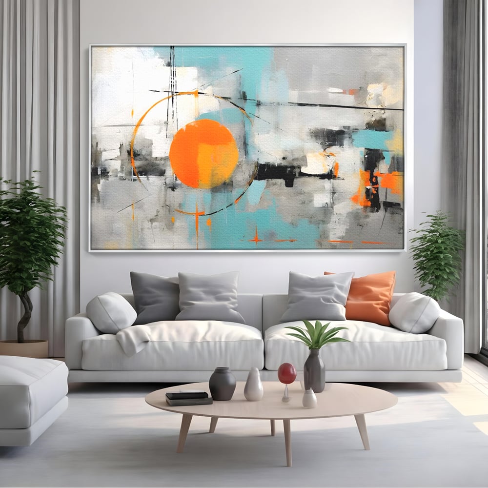 Tablou canvas cu pictura abstracta cu cerc portocaliu, in rama de aluminiu argintiu, pe perete intr-un living